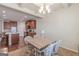 Dining room with open concept to kitchen with brown cabinets and granite counters at 4050 Villagewood Ln, Ellenwood, GA 30294
