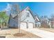 Charming two-story home with a spacious two-car garage and well-maintained lawn at 4050 Villagewood Ln, Ellenwood, GA 30294