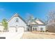 Charming two-story home featuring a two-car garage and traditional siding at 4050 Villagewood Ln, Ellenwood, GA 30294