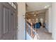 Inviting foyer with staircase and views of a cozy living room with fireplace at 4050 Villagewood Ln, Ellenwood, GA 30294