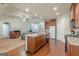 Open-concept kitchen with granite countertops and direct views to living and dining area at 4050 Villagewood Ln, Ellenwood, GA 30294