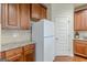 Kitchen with wood cabinetry, granite countertops, and stainless appliances at 4050 Villagewood Ln, Ellenwood, GA 30294