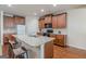 Kitchen featuring a large island with bar seating, granite countertops, and stainless appliances at 4050 Villagewood Ln, Ellenwood, GA 30294