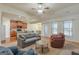 Spacious living room showcasing an open floor plan with kitchen access and natural light at 4050 Villagewood Ln, Ellenwood, GA 30294