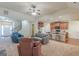 Inviting living area with an open floor plan, showcasing seamless transition to kitchen and staircase at 4050 Villagewood Ln, Ellenwood, GA 30294