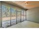 The home has a screened in porch with a metal security gate to the yard at 4050 Villagewood Ln, Ellenwood, GA 30294