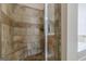 Beautifully tiled shower featuring neutral tones at 4050 Villagewood Ln, Ellenwood, GA 30294