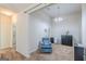 Sitting room with a comfortable blue chair and neutral paint at 4050 Villagewood Ln, Ellenwood, GA 30294