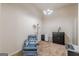 Comfortable sitting room including a reading chair, lamp, and black storage cabinet at 4050 Villagewood Ln, Ellenwood, GA 30294