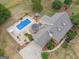 Aerial view showcasing a home with an in-ground pool, gazebo, and manicured landscaping at 245 Jewel Blf, Fayetteville, GA 30214