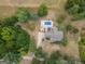 Breathtaking aerial shot of a home and its surrounding landscape with a pool and ample greenery at 245 Jewel Blf, Fayetteville, GA 30214