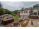 Beautiful backyard with landscaped terraces, pool and deck at 245 Jewel Blf, Fayetteville, GA 30214