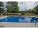 Inviting inground pool with a sunny deck area for lounging and enjoying the outdoors at 245 Jewel Blf, Fayetteville, GA 30214