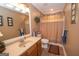Bathroom showcasing vanity with sink, a framed mirror, and a shower with curtain at 245 Jewel Blf, Fayetteville, GA 30214