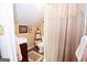 Cozy bathroom features neutral finishes, shower and sink with convenient storage at 245 Jewel Blf, Fayetteville, GA 30214