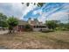 Charming single-Gathering home with a brick exterior, complemented by a well-maintained lawn and mature trees at 245 Jewel Blf, Fayetteville, GA 30214
