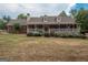 Charming exterior view of a home with a covered front porch and well-manicured landscaping at 245 Jewel Blf, Fayetteville, GA 30214