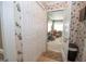 Hallway with wallpaper accents leading to a sunroom or seating area at 245 Jewel Blf, Fayetteville, GA 30214