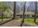 Charming single Gathering home with classic white trim, black shutters, and inviting front porch at 65 Dundee Pl, Sharpsburg, GA 30277