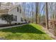 Charming home exterior with a well-maintained lawn, manicured landscaping, and a welcoming walkway at 65 Dundee Pl, Sharpsburg, GA 30277
