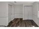Bedroom featuring white walls, wood-look vinyl flooring, one window, and closet at 111 Highway 138 E, Stockbridge, GA 30281