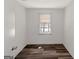 Bedroom featuring white walls, wood-look vinyl flooring and a window at 111 Highway 138 E, Stockbridge, GA 30281