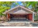 Spacious detached two-car garage featuring ample storage and a red metal roof at 111 Highway 138 E, Stockbridge, GA 30281