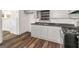 Charming kitchen boasts hardwood floors, granite countertops, and stainless steel appliances at 111 Highway 138 E, Stockbridge, GA 30281