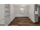 Inviting living room boasts hardwood floors, built-in shelves, and ample natural light at 111 Highway 138 E, Stockbridge, GA 30281