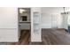 Open living room showcases hardwood floors and a view into the kitchen at 111 Highway 138 E, Stockbridge, GA 30281