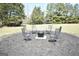 Backyard with seating surrounding a fire pit for outdoor enjoyment at 116 Ducati Dr, Mcdonough, GA 30252