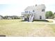 Spacious backyard featuring a two-story home with a deck and well-maintained lawn at 116 Ducati Dr, Mcdonough, GA 30252