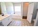 Bathroom featuring soaking tub, window, toilet, and vanity sink at 116 Ducati Dr, Mcdonough, GA 30252