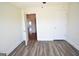Bedroom featuring hardwood floors, ceiling fan, and ensuite bathroom at 116 Ducati Dr, Mcdonough, GA 30252