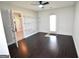 Bedroom with dark wood flooring, walk in closet, and exterior door access to the backyard at 116 Ducati Dr, Mcdonough, GA 30252