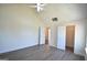 Bright bedroom with vaulted ceiling, ceiling fan, wood-look flooring, closet, and ensuite bathroom at 116 Ducati Dr, Mcdonough, GA 30252