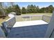 Open view from deck showing lush backyard with shed and mature trees at 116 Ducati Dr, Mcdonough, GA 30252