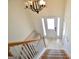 Bright entryway featuring tiled floors, a chandelier, a bench and a front door with sidelights at 116 Ducati Dr, Mcdonough, GA 30252