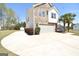 Attractive home showcasing a stone and siding exterior, an attached garage, and a well-maintained lawn at 116 Ducati Dr, Mcdonough, GA 30252