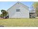 Exterior view of the home showing the side and back of the house and yard at 116 Ducati Dr, Mcdonough, GA 30252