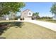 Exterior of home with stone and siding and a long driveway leading to a garage at 116 Ducati Dr, Mcdonough, GA 30252
