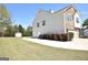 Exterior of home featuring a manicured backyard, storage shed and trees at 116 Ducati Dr, Mcdonough, GA 30252