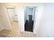 Hallway featuring stylish tile flooring connecting to laundry and additional rooms at 116 Ducati Dr, Mcdonough, GA 30252