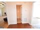 Hallway leading to bathroom, showcasing clean lines and neutral tones at 116 Ducati Dr, Mcdonough, GA 30252