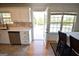 Bright kitchen with stainless steel appliances and an open door to the deck at 116 Ducati Dr, Mcdonough, GA 30252