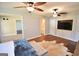 Spacious main bedroom with hardwood floors, ceiling fans, built-in cabinets and ample closet space at 116 Ducati Dr, Mcdonough, GA 30252