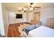 Spacious main bedroom with hardwood floors, ceiling fans, built-in cabinets and ample closet space at 116 Ducati Dr, Mcdonough, GA 30252