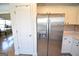 Side-by-side stainless steel refrigerator complements the white cabinets in this kitchen at 116 Ducati Dr, Mcdonough, GA 30252