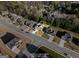 Aerial view of a single Gathering home in a residential neighborhood with tree lined street at 6870 Diamond Dr, Rex, GA 30273