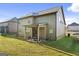 The backyard features a covered patio, offering a great space for outdoor dining and relaxation at 6870 Diamond Dr, Rex, GA 30273